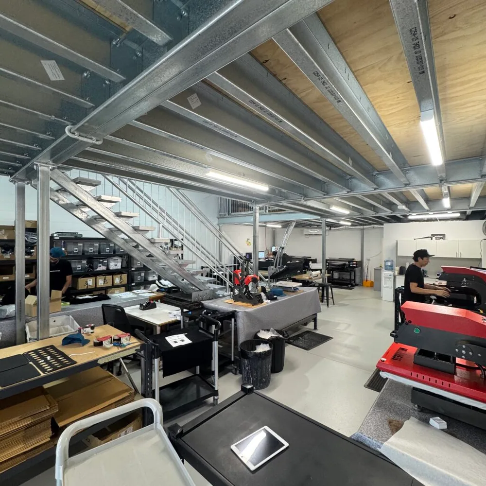 Screenlab's current production floor, where DTF printing and pressing happens